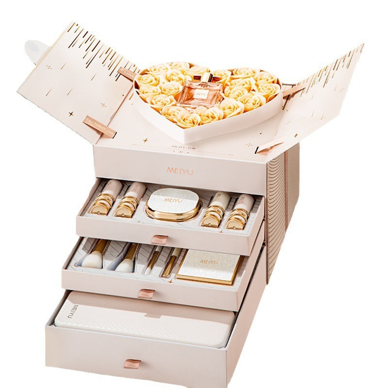 Cosmetic set with skincare products in a decorative box on a white background
