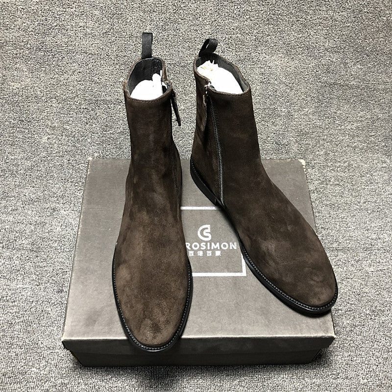 Pair of brown suede boots on a gray box with 'Grosimon' branding.