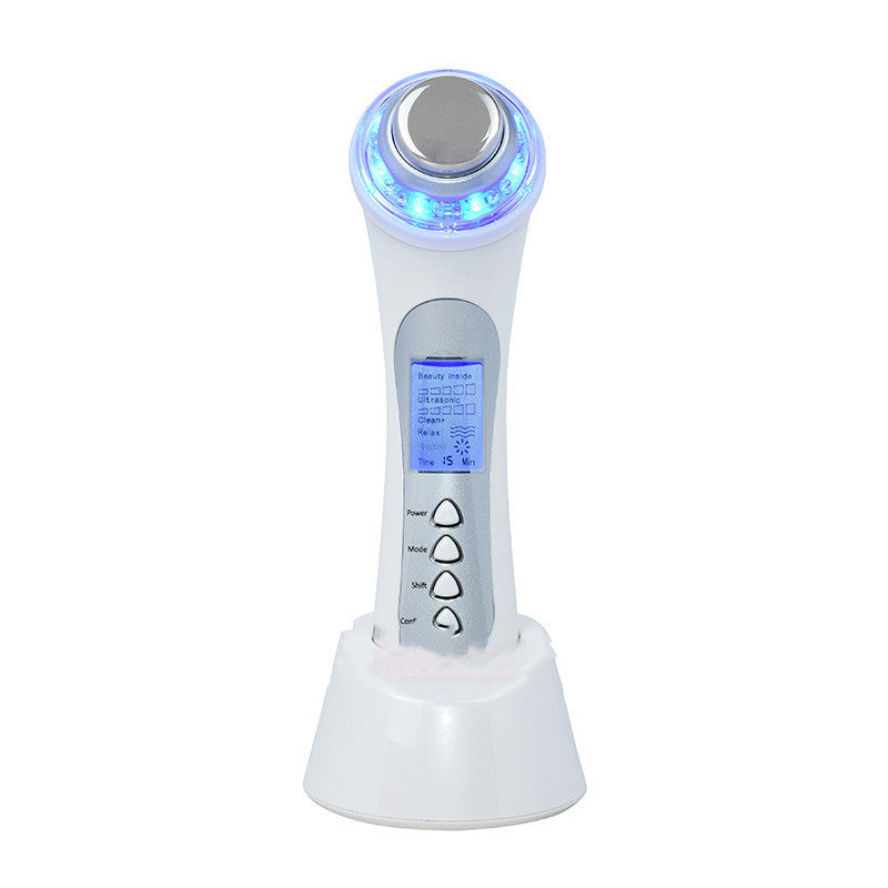 White electronic device with blue light on a white background