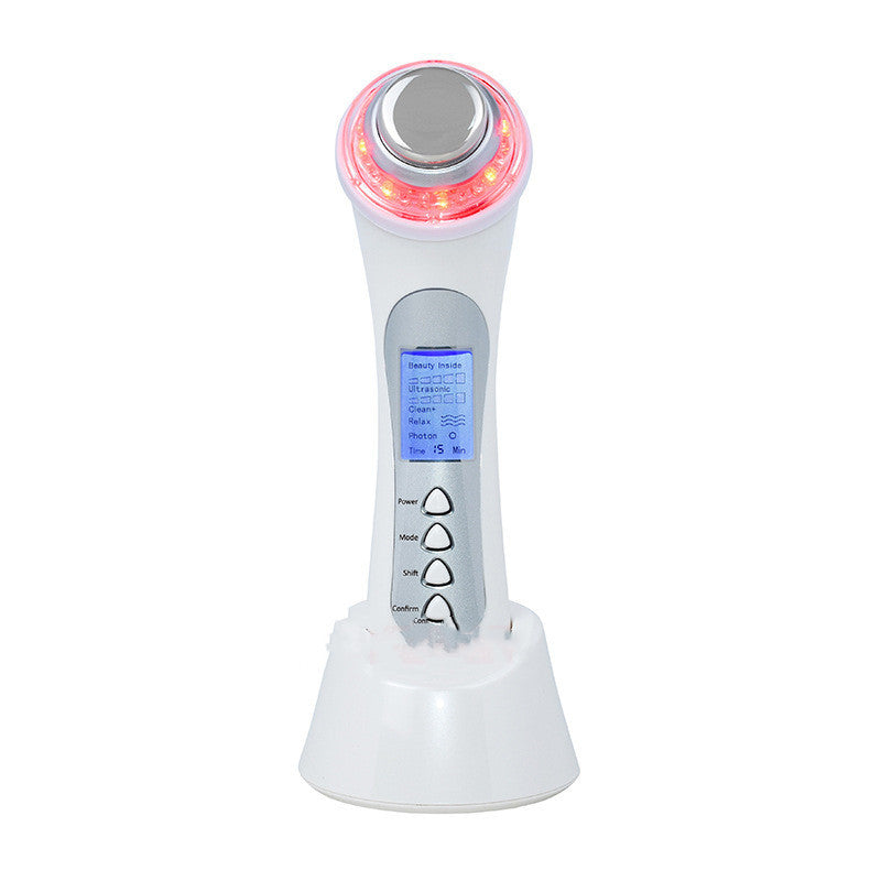White electronic device with digital display and red light on a white background