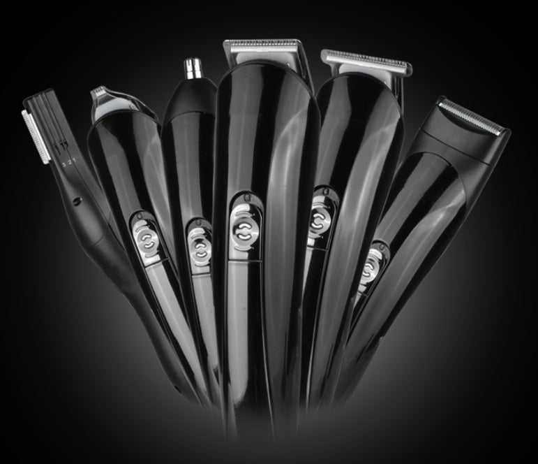 Set of black hair clippers on a dark background