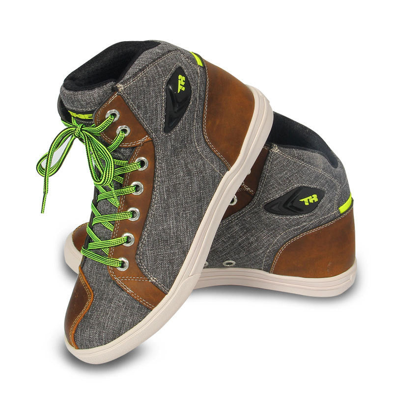 Gray and brown high-top sneakers with green laces on a white background