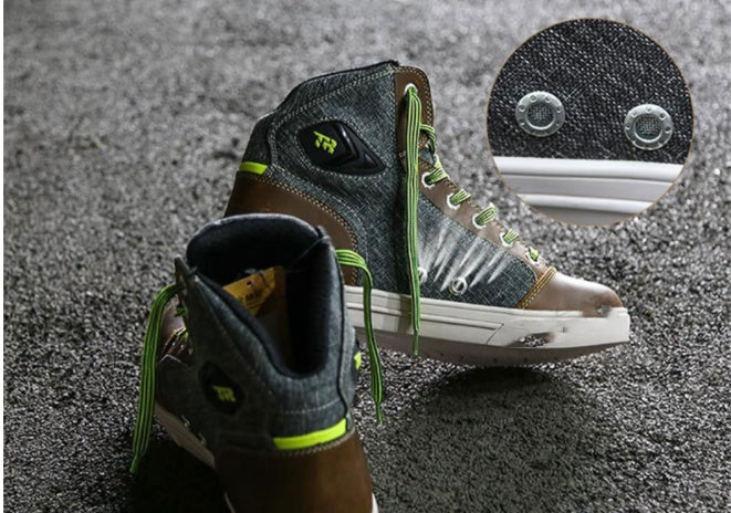 Pair of high-top sneakers with green laces on a textured surface