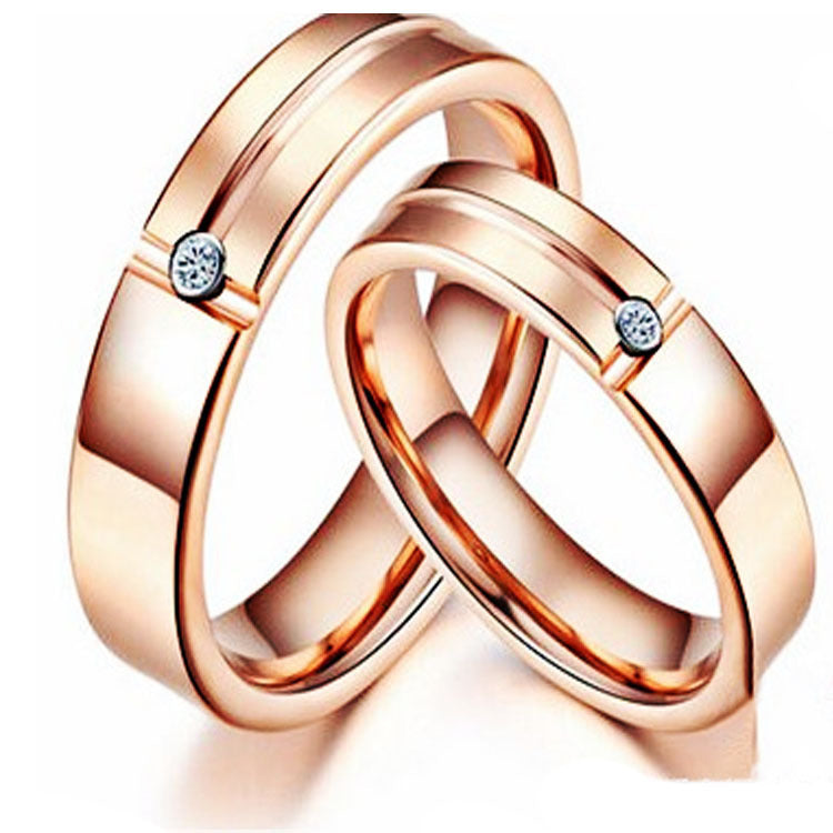 Rose gold rings with small diamonds on a white background