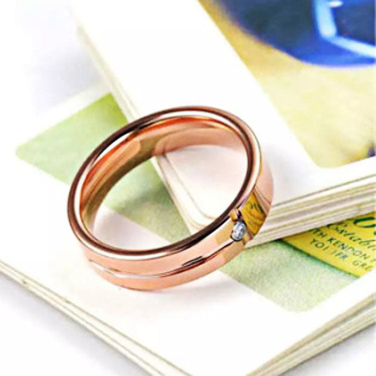 Rose gold bracelet on a magazine page