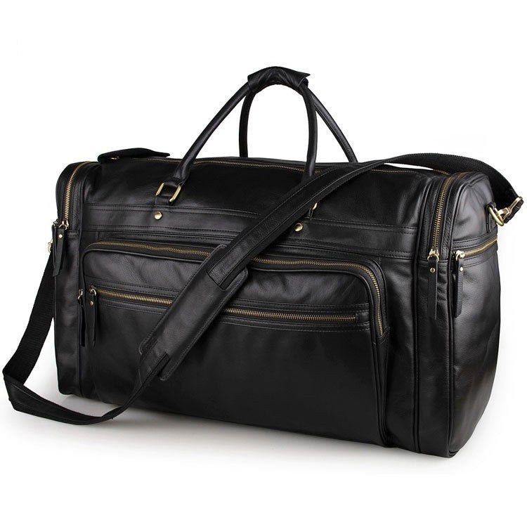 Black leather duffel bag with gold zipper details on a white background