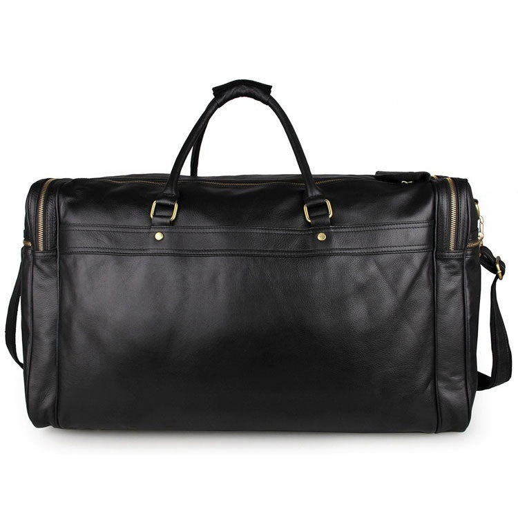 Black leather duffel bag with gold hardware on a white background