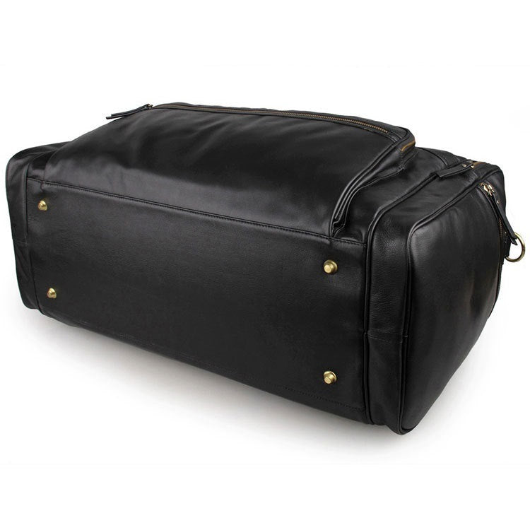 Black leather duffel bag with gold hardware on a white background