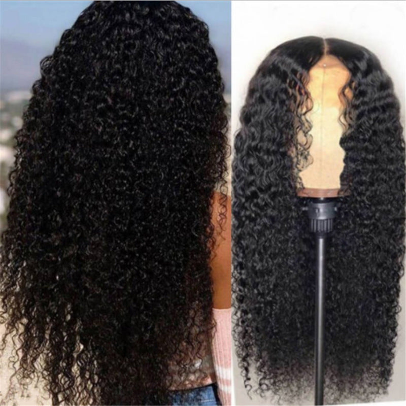 Curly wig displayed on a mannequin head with a blurred outdoor background