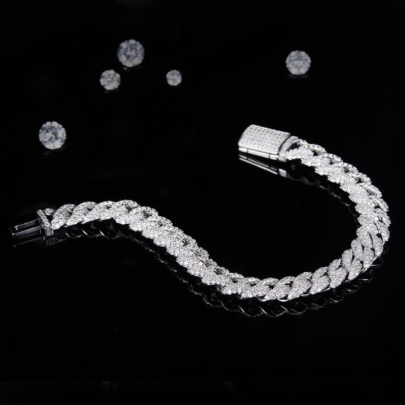 Silver bracelet with clear stones on a black background