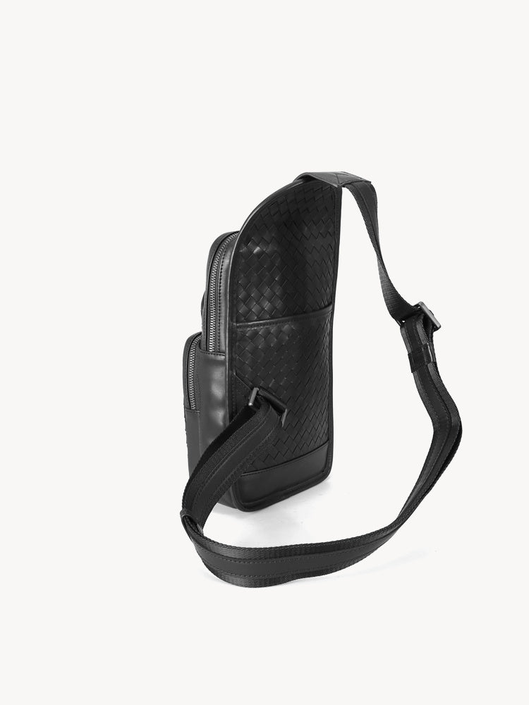 Black leather shoulder bag with a textured pattern on a white background