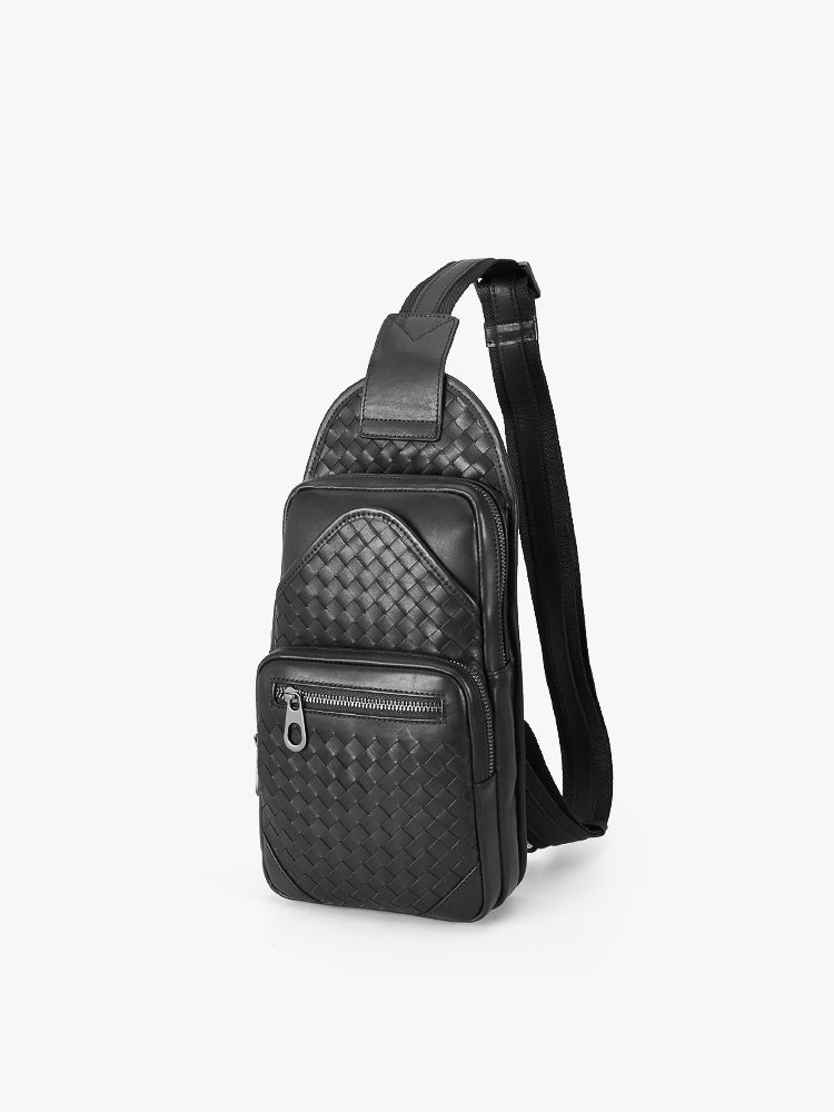 Black woven patterned sling bag on a white background