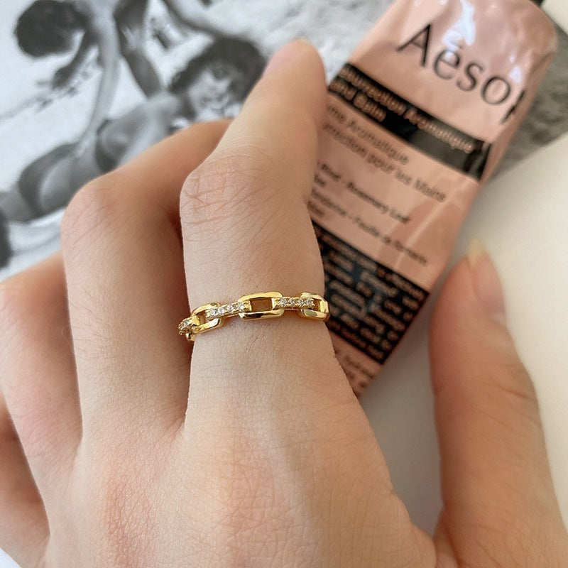 Gold ring on a finger with a blurred background