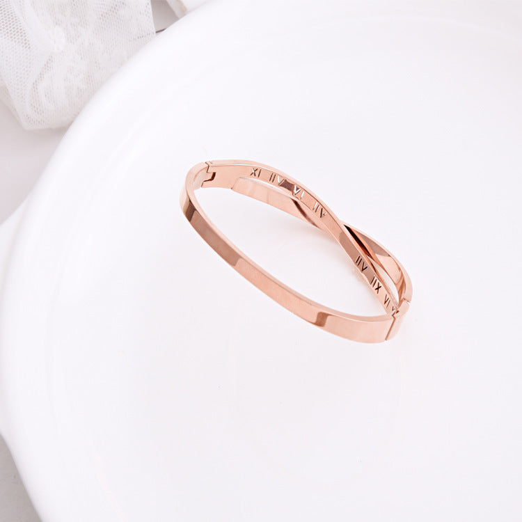 Rose gold bracelet on a white surface