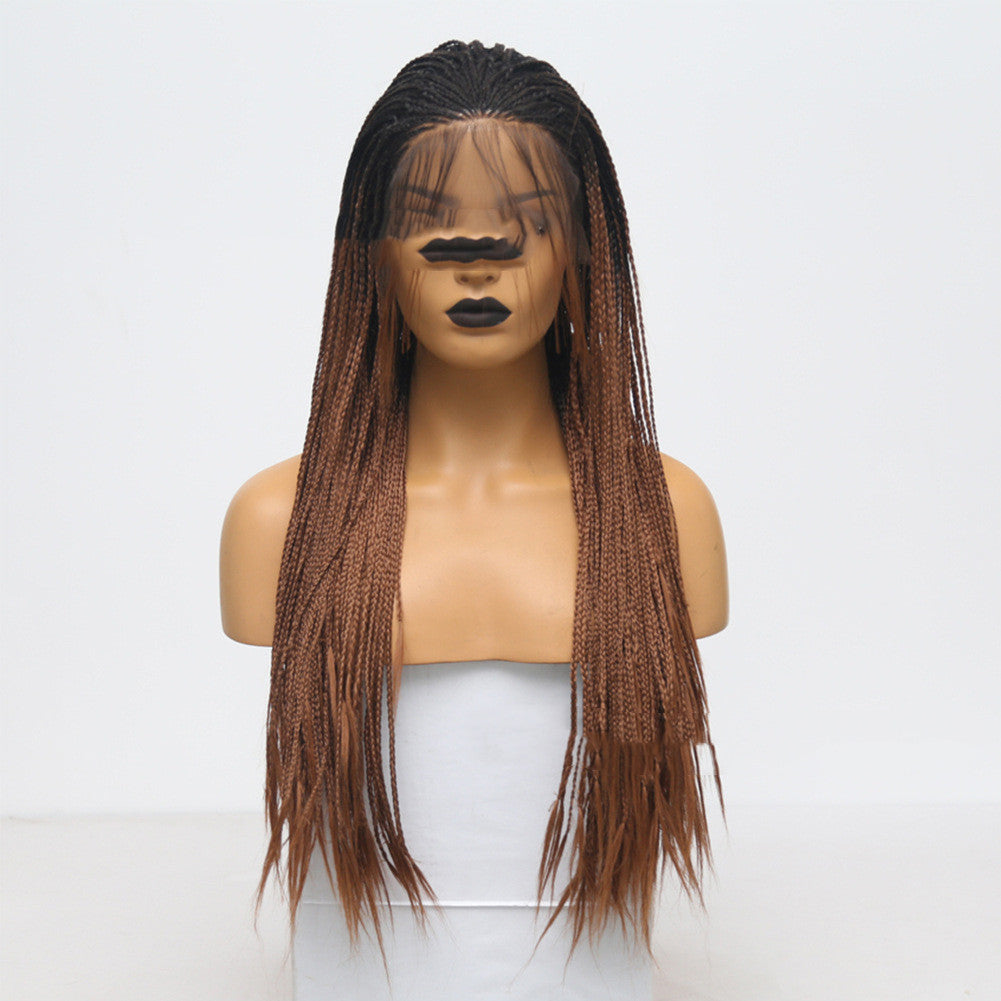 Mannequin head with a brown braided wig on a white background