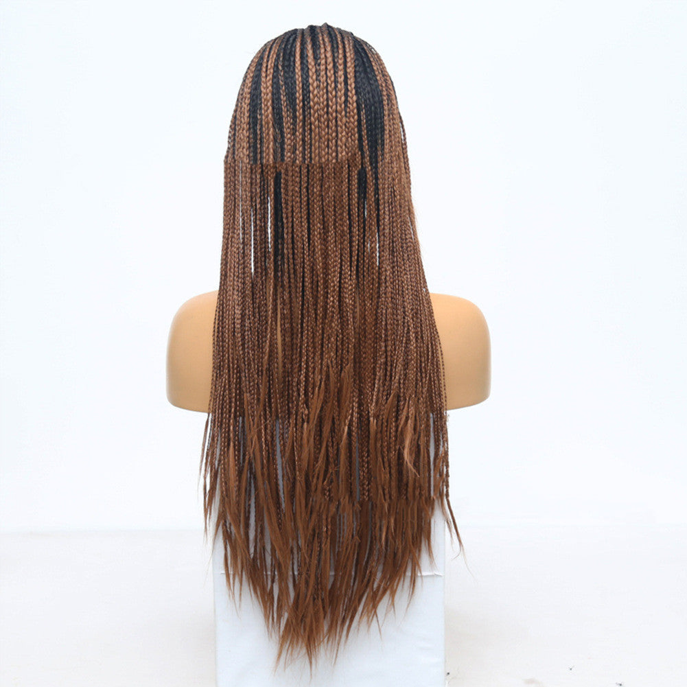 Mannequin head with long braided hair on a white background