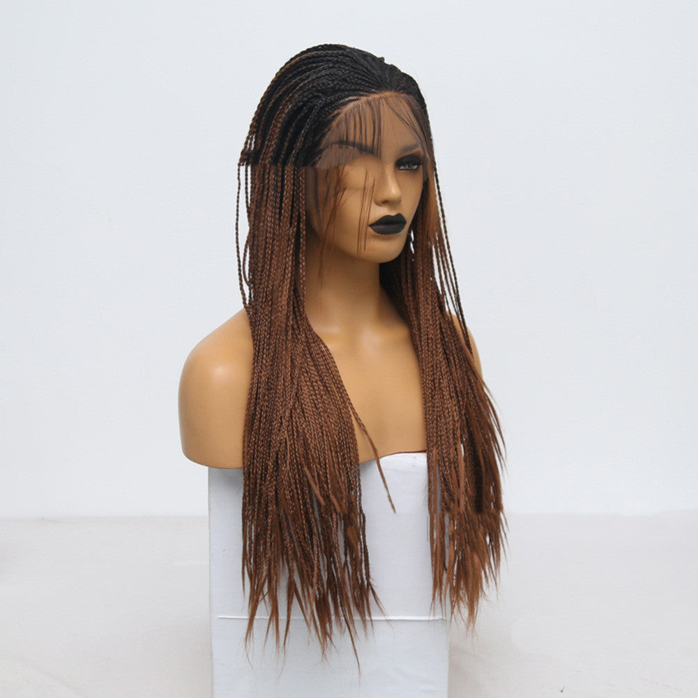 Mannequin head with a brown braided wig on a white background