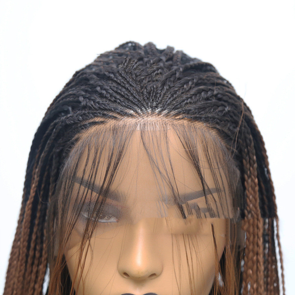 Mannequin head with a braided wig on a white background