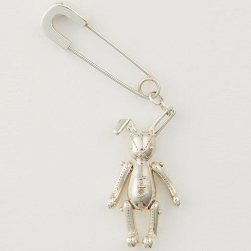 Silver rabbit-shaped brooch on a white background
