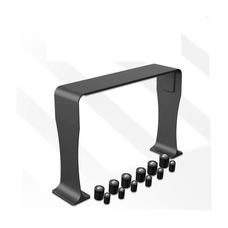 Black metal console table with decorative knobs on a white background