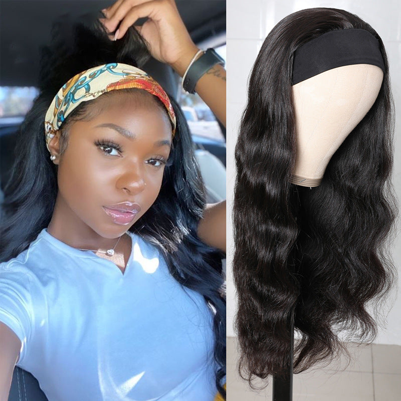 Woman with styled hair and a wig on a mannequin head.