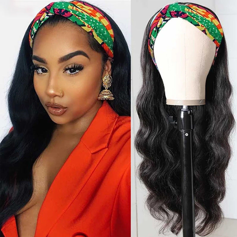 Woman wearing a colorful headband with a wig on a mannequin head.
