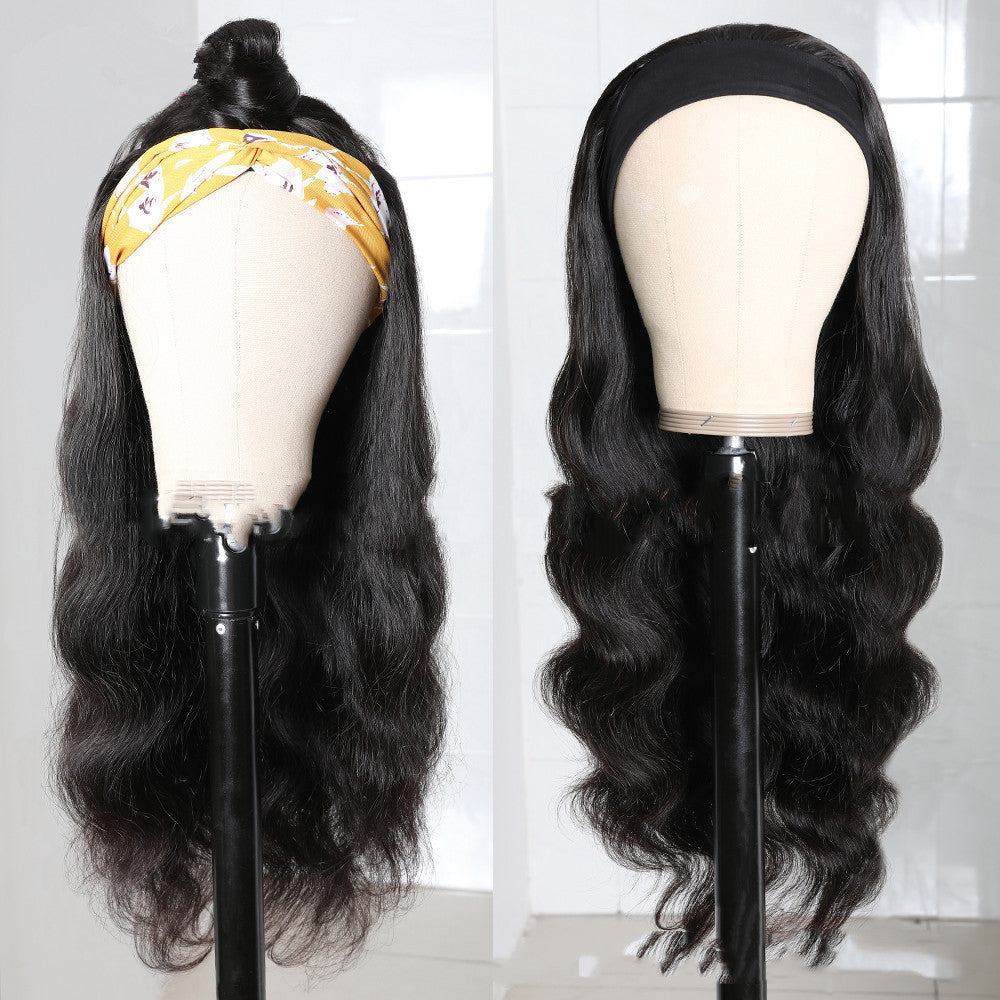 Two mannequin heads with long black wigs on a white background