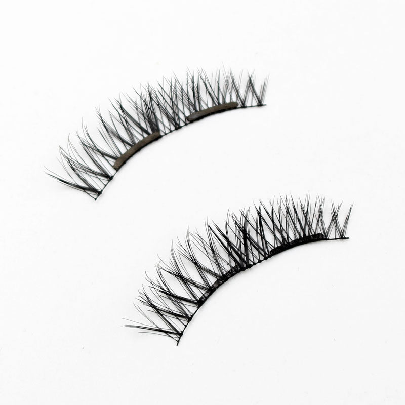 Pair of false eyelashes on a white background
