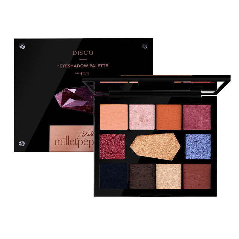 Makeup eyeshadow palette with various colors on a white background