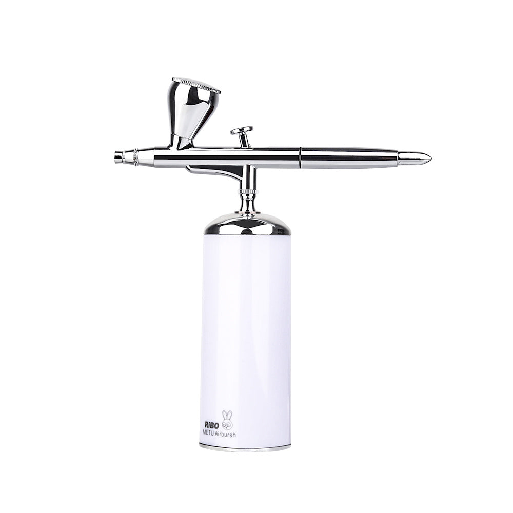 White airbrush with silver nozzle on a white background