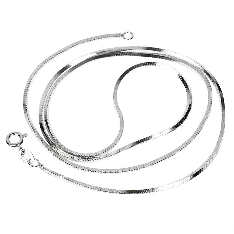 Silver snake chain necklace on a white background