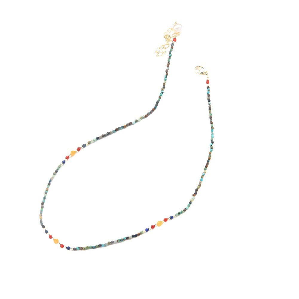 Multicolored beaded necklace on a white background