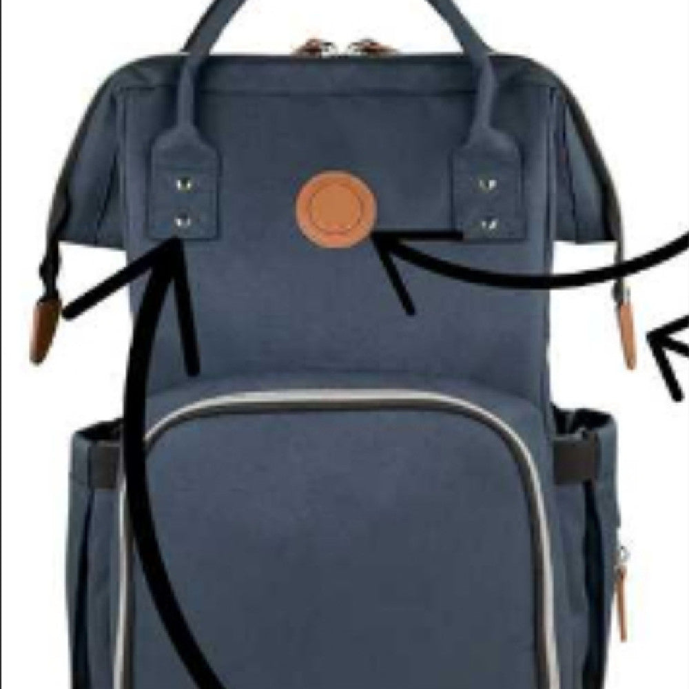 Navy blue backpack with a brown circular patch on a white background