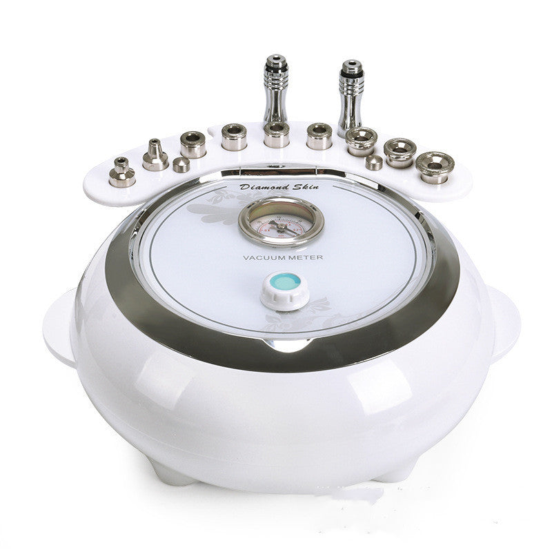 White device with multiple attachments on a white background