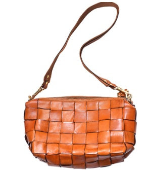 Brown woven handbag with a strap on a white background