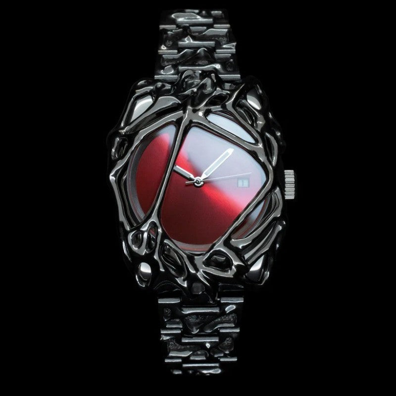 Elegant watch with a red face and intricate silver design on a black background