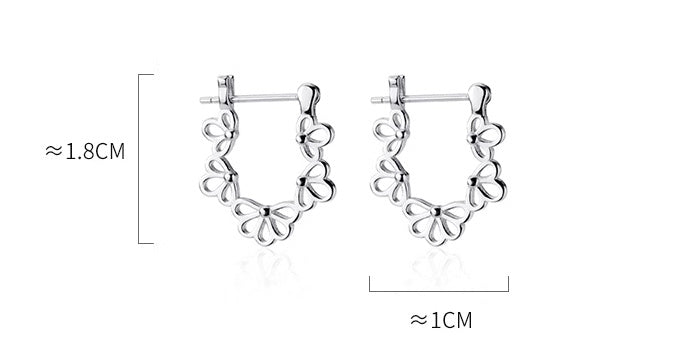 Silver hoop earrings with measurements on a white background