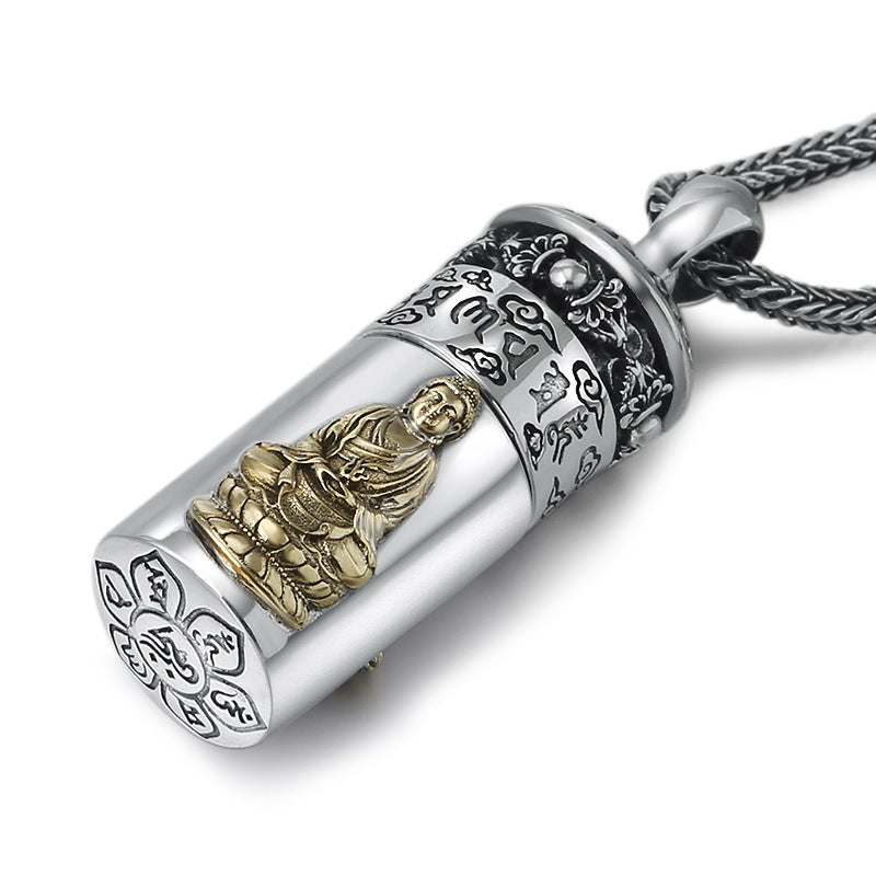 Silver and gold pendant with Buddha figure on a white background