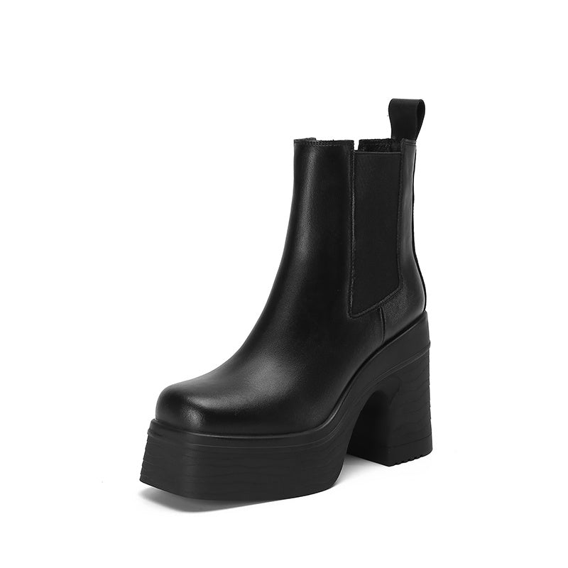 Black platform Chelsea boot on a white background