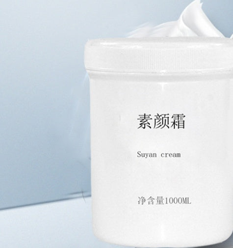 White jar of Suyan cream on a light blue background