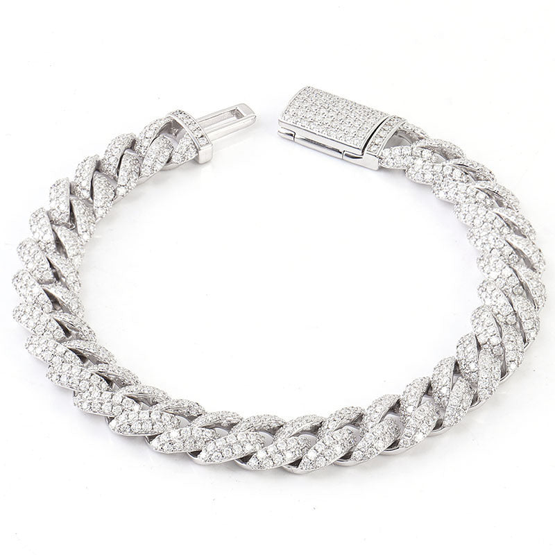 Silver braided bracelet with clear stones on a white background