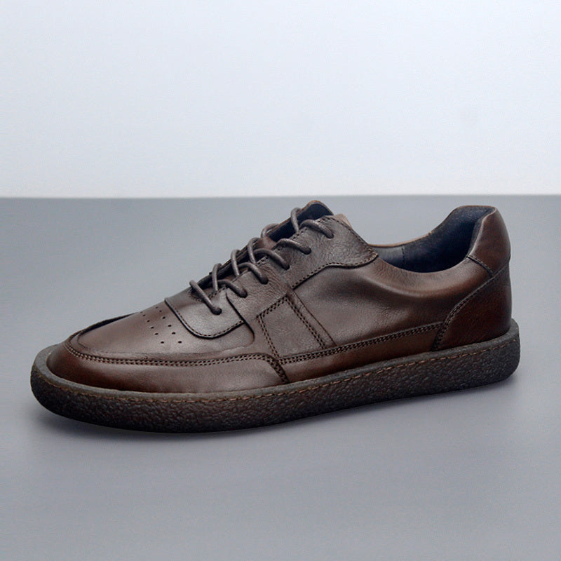 Brown leather sneaker on a gray background
