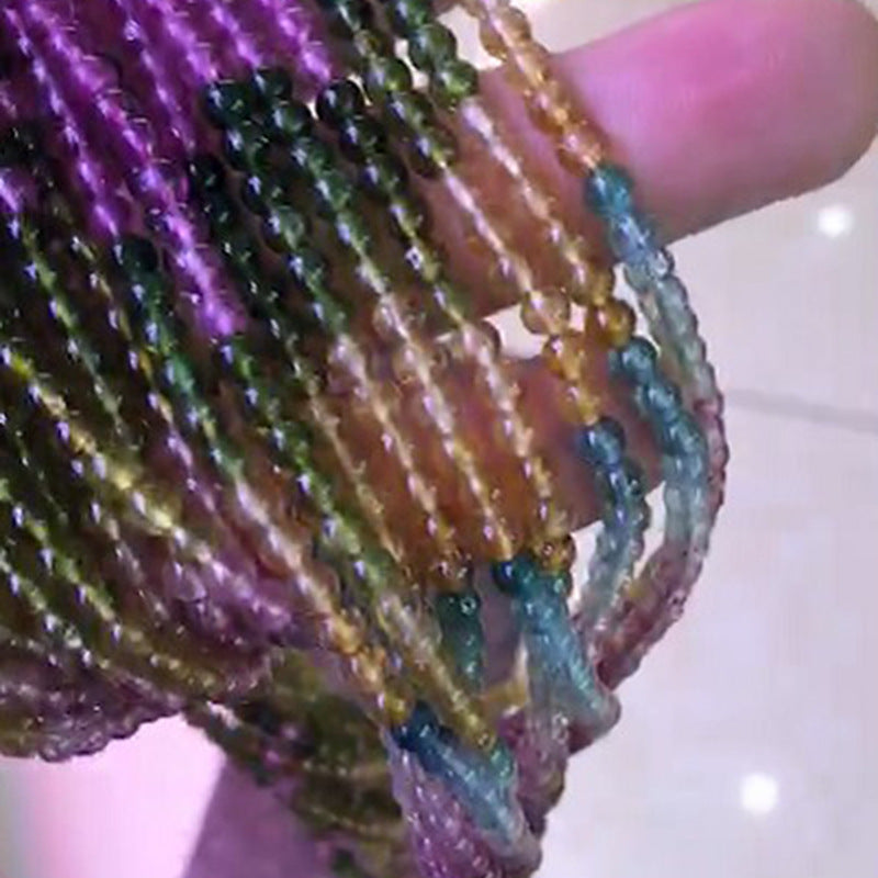Close-up of multicolored beaded bracelets on a hand