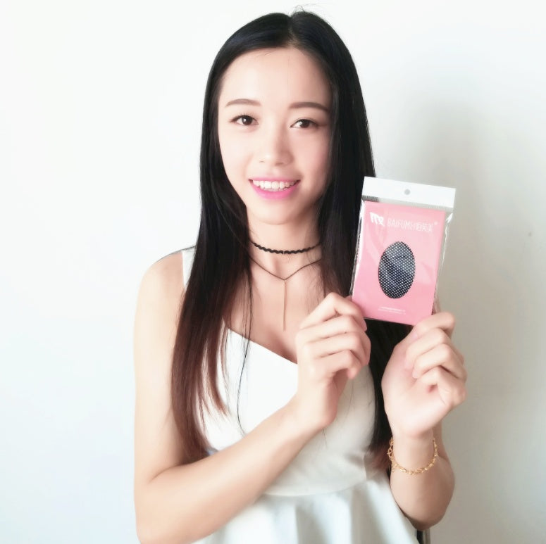 Woman holding a pink package with a black circle on a white background