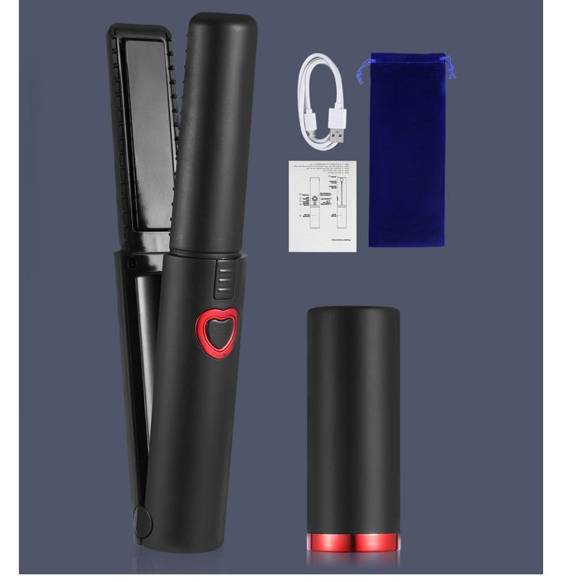 Black hair straightener with red accents, packaging, and accessories on a dark background