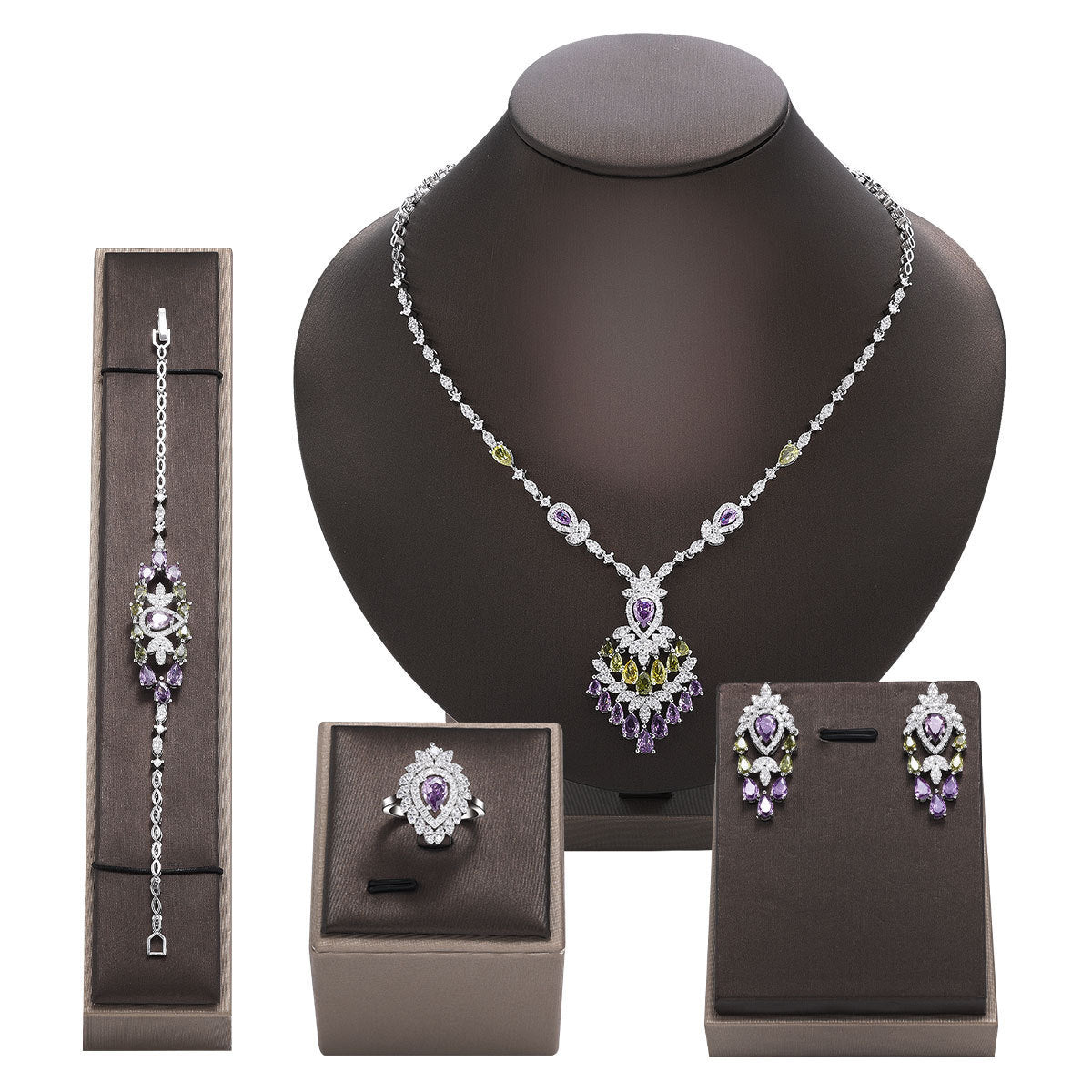 Jewelry set including necklace, bracelet, and earrings on a mannequin bust with display boxes.