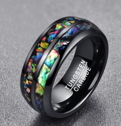 Black tungsten carbide ring with colorful inlay on a gray background