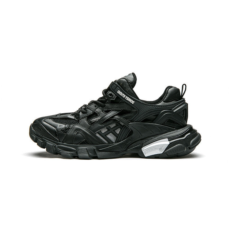 Black sneaker with brand logo on a white background