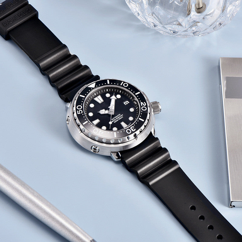 Wristwatch with black strap and silver case on a light blue background