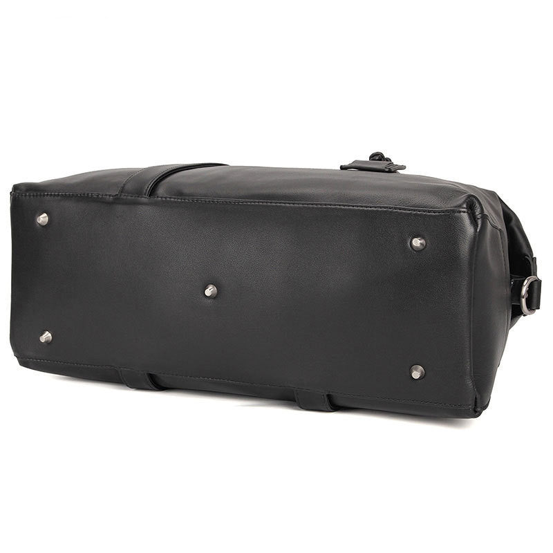 Black leather duffel bag with silver rivets on a white background